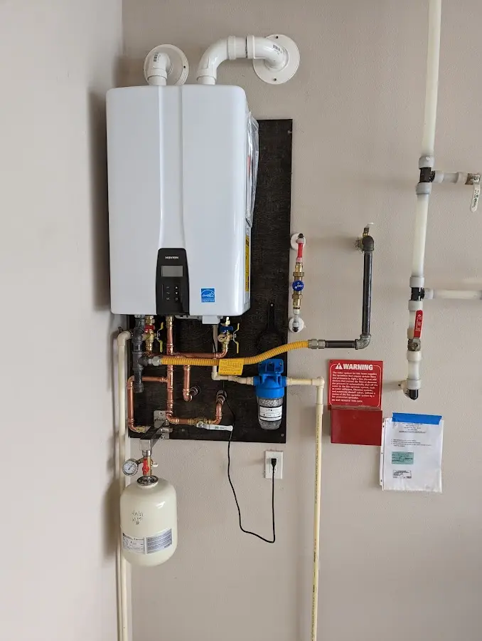 Professional plumber installing copper piping in a Ruidoso home